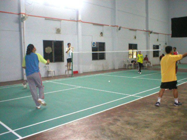 badminton court with players for a sporting house