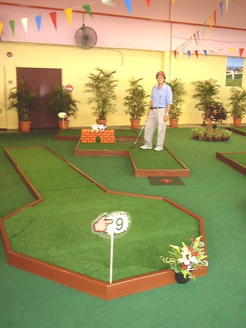 miniature golf hole 8 putting with humpy dumpty sitting on a wall